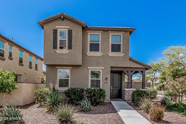 2640 N Heritage St, Buckeye, AZ 85396 - view of front of property with a tiled roof, stucco siding, and fence