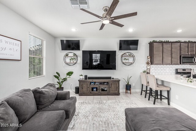 2640 N Heritage St, Buckeye, AZ 85396 - living room with light tile patterned flooring, baseboards, visible vents, ceiling fan, and recessed lighting