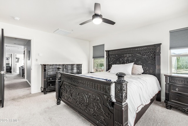 2640 N Heritage St, Buckeye, AZ 85396 - bedroom with carpet flooring, a ceiling fan, multiple windows, and visible vents