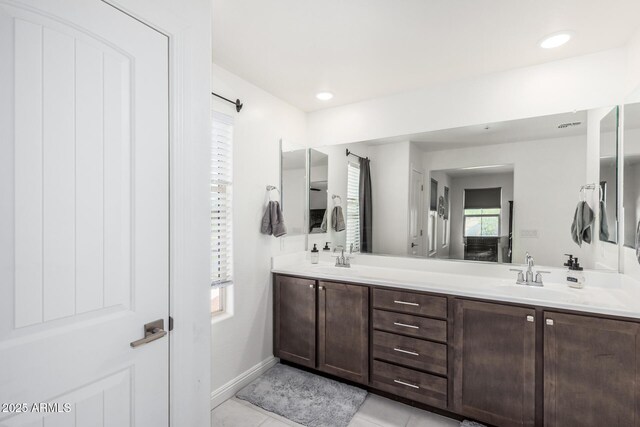 2640 N Heritage St, Buckeye, AZ 85396 - full bath with tile patterned floors, a sink, recessed lighting, baseboards, and double vanity