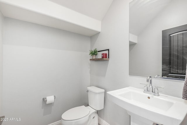 2640 N Heritage St, Buckeye, AZ 85396 - half bath featuring toilet, a sink, and baseboards