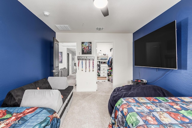 2640 N Heritage St, Buckeye, AZ 85396 - carpeted bedroom with a spacious closet, a ceiling fan, a closet, and visible vents