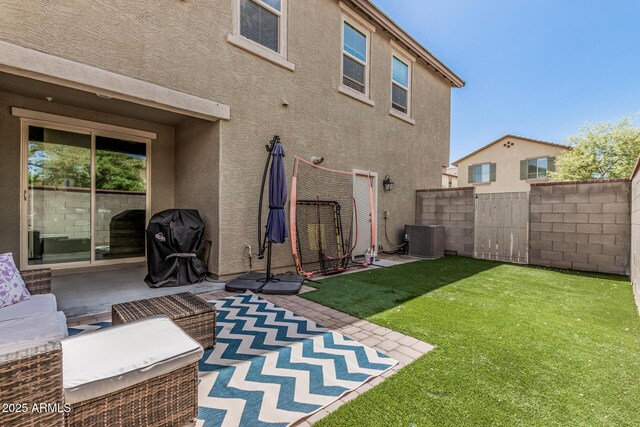 2640 N Heritage St, Buckeye, AZ 85396 - back of house featuring a patio area, cooling unit, stucco siding, fence, and a lawn