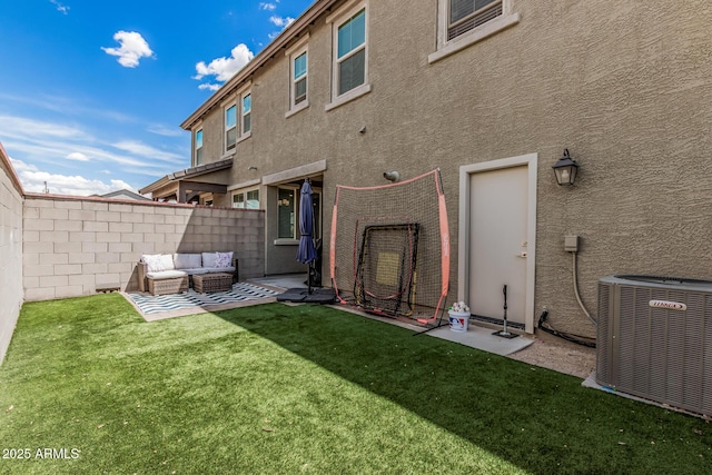2640 N Heritage St, Buckeye, AZ 85396 - rear view of property with an outdoor hangout area, stucco siding, a fenced backyard, central AC unit, and a yard