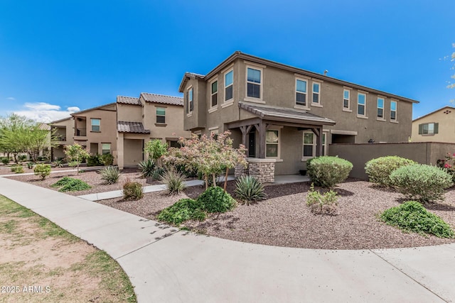 2640 N Heritage St, Buckeye, AZ 85396 - view of front of home with stucco siding, fence, and a tiled roof