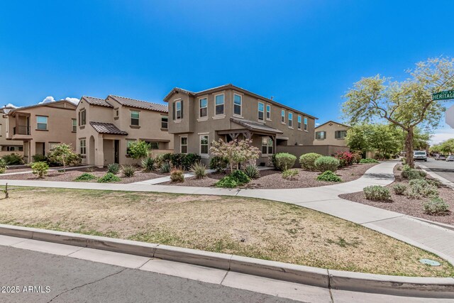 2640 N Heritage St, Buckeye, AZ 85396 - view of front facade featuring a residential view, stucco siding, and a tiled roof
