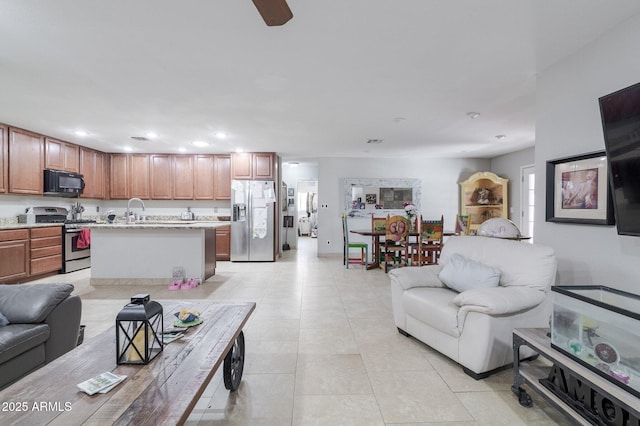 living room featuring recessed lighting and light tile patterned floors