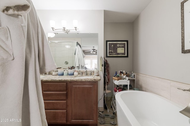 bathroom featuring vanity, a washtub, and a shower stall