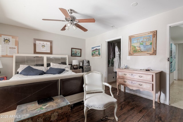 bedroom with a ceiling fan and wood finished floors