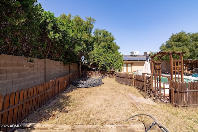 view of yard featuring a fenced backyard and a pergola