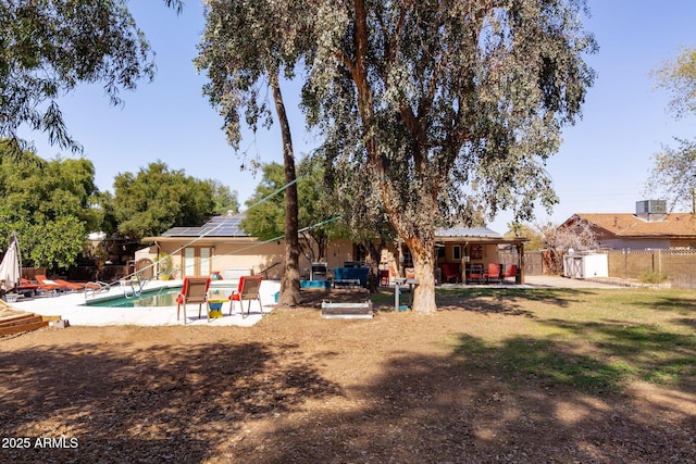 exterior space featuring a patio area, a fenced backyard, and a fenced in pool