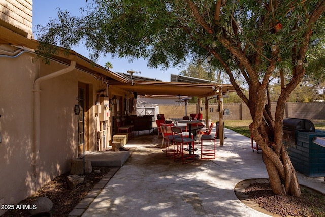 view of patio / terrace featuring outdoor dining space and fence