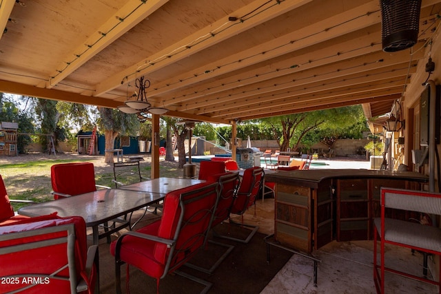 view of patio with a fenced backyard and outdoor dining area