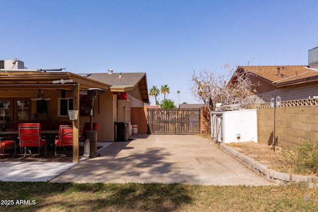 view of patio / terrace with fence and a gate