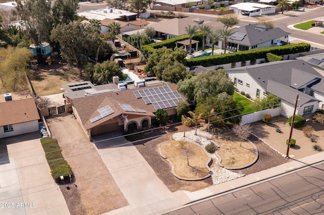 birds eye view of property with a residential view