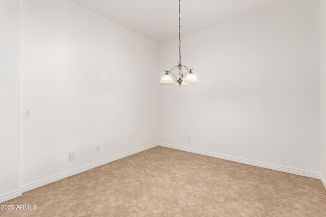 unfurnished room featuring a notable chandelier