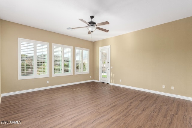 spare room featuring ceiling fan and hardwood / wood-style floors