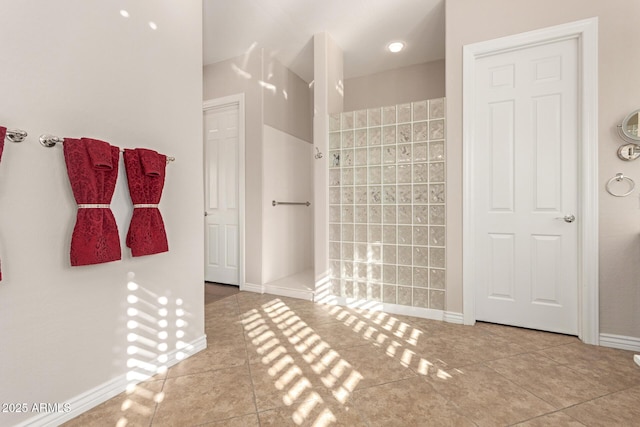 bathroom featuring a shower and tile patterned floors