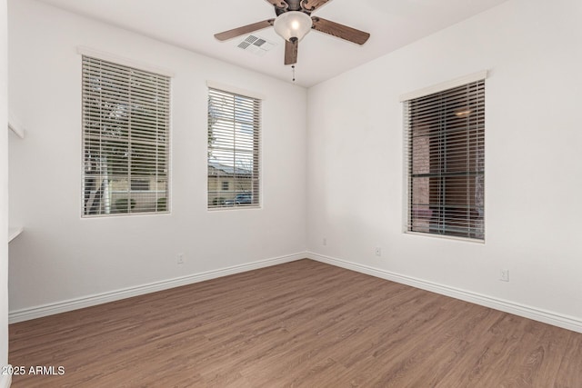 empty room featuring ceiling fan and wood-type flooring