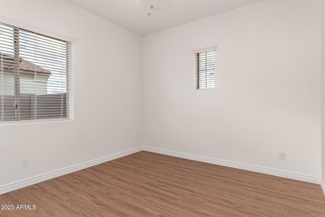 spare room featuring hardwood / wood-style floors