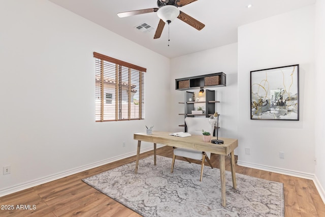 office featuring ceiling fan and light hardwood / wood-style flooring