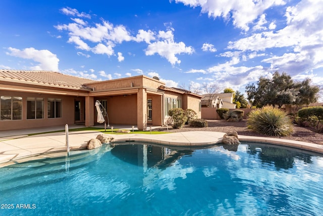 view of swimming pool featuring a patio