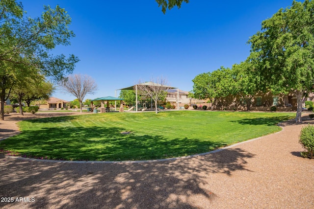 surrounding community with a gazebo and a lawn