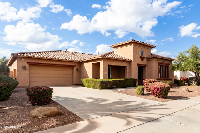 mediterranean / spanish-style house with a garage