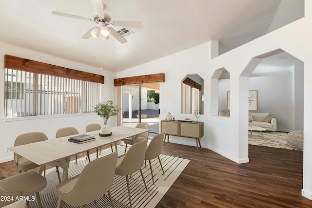 dining space featuring lofted ceiling, visible vents, baseboards, and wood finished floors