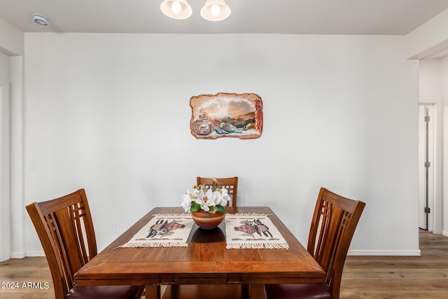 dining area with hardwood / wood-style flooring