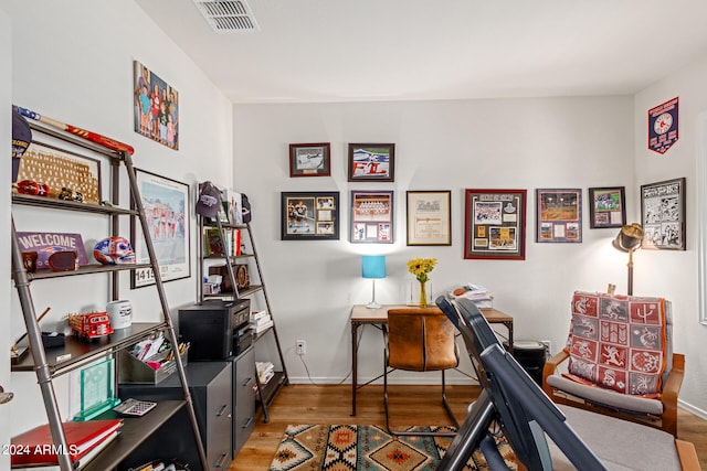 office space with hardwood / wood-style floors