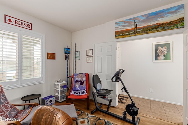 workout area with hardwood / wood-style flooring