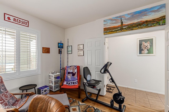 17540 W Glenhaven Dr, Goodyear, AZ 85338 - exercise room featuring baseboards and wood finished floors