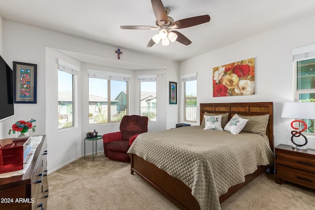 17540 W Glenhaven Dr, Goodyear, AZ 85338 - bedroom featuring light carpet, baseboards, and ceiling fan