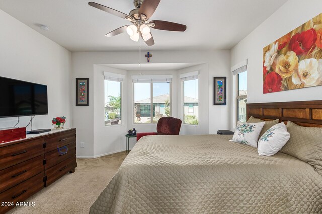 17540 W Glenhaven Dr, Goodyear, AZ 85338 - bedroom featuring a ceiling fan, baseboards, and light colored carpet