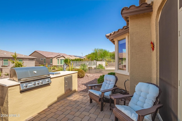 17540 W Glenhaven Dr, Goodyear, AZ 85338 - view of patio / terrace featuring area for grilling, fence, and grilling area