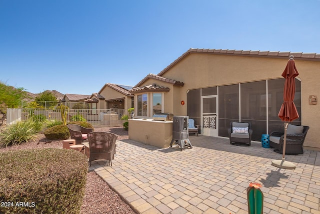 17540 W Glenhaven Dr, Goodyear, AZ 85338 - view of patio / terrace featuring a sunroom and fence