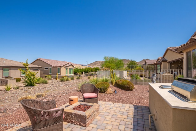 view of patio with an outdoor fire pit