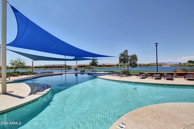 view of pool with a water view