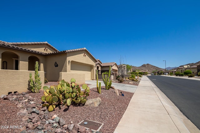 17540 W Glenhaven Dr, Goodyear, AZ 85338 - exterior space with a tile roof, stucco siding, an attached garage, and concrete driveway