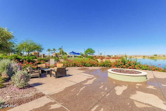 view of patio featuring a water view