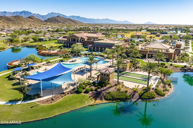 drone / aerial view with a water and mountain view