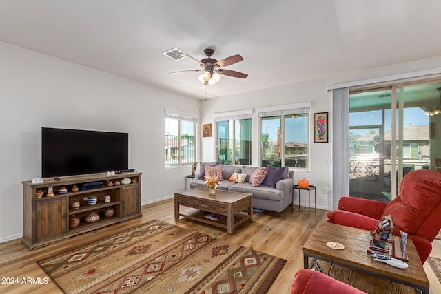 living room featuring ceiling fan and light hardwood / wood-style flooring