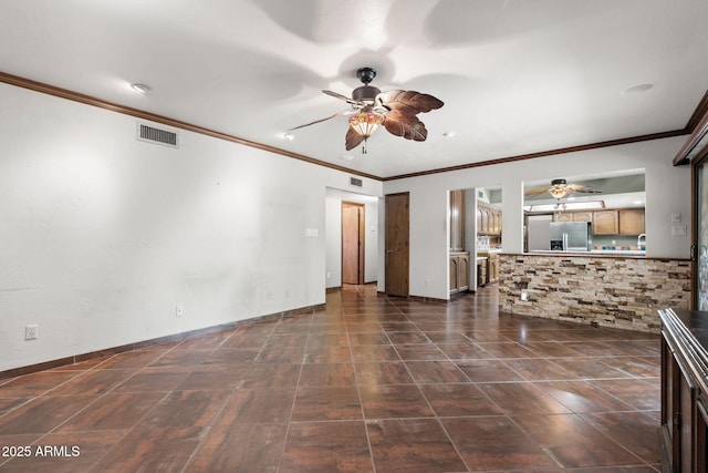 unfurnished living room featuring ceiling fan, crown molding, and baseboards
