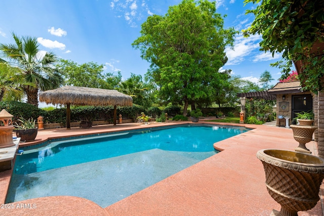 outdoor pool featuring a gazebo and a patio area