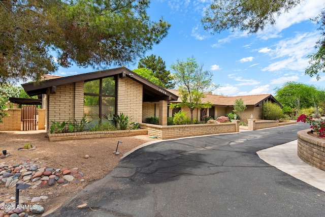 view of front of property featuring brick siding
