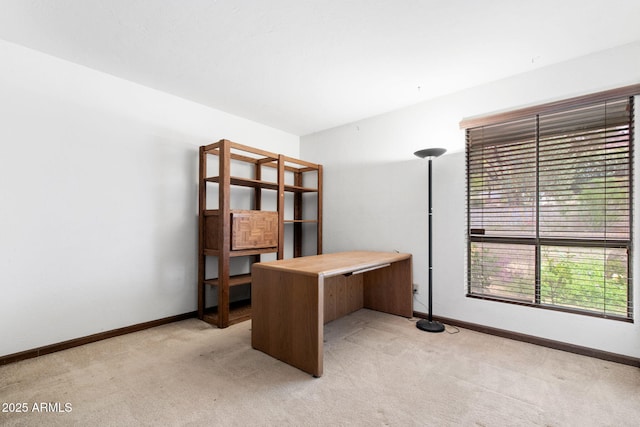 office featuring light carpet and baseboards