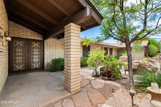 entrance to property with brick siding
