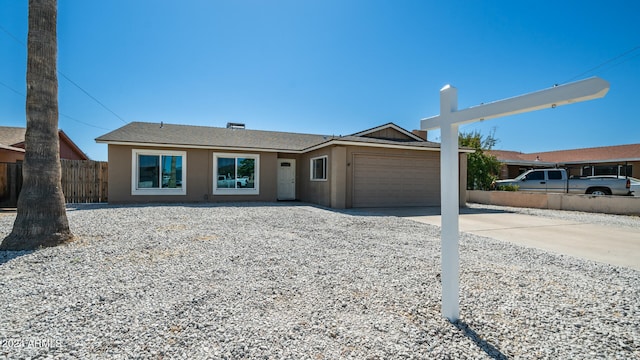 single story home with a garage