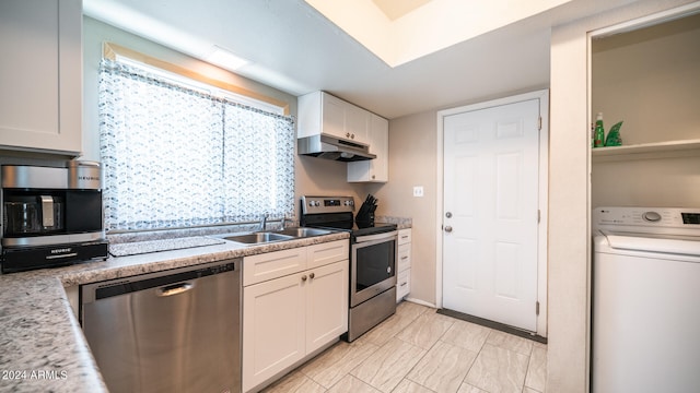 kitchen featuring sink, washer / dryer, stainless steel appliances, and white cabinets